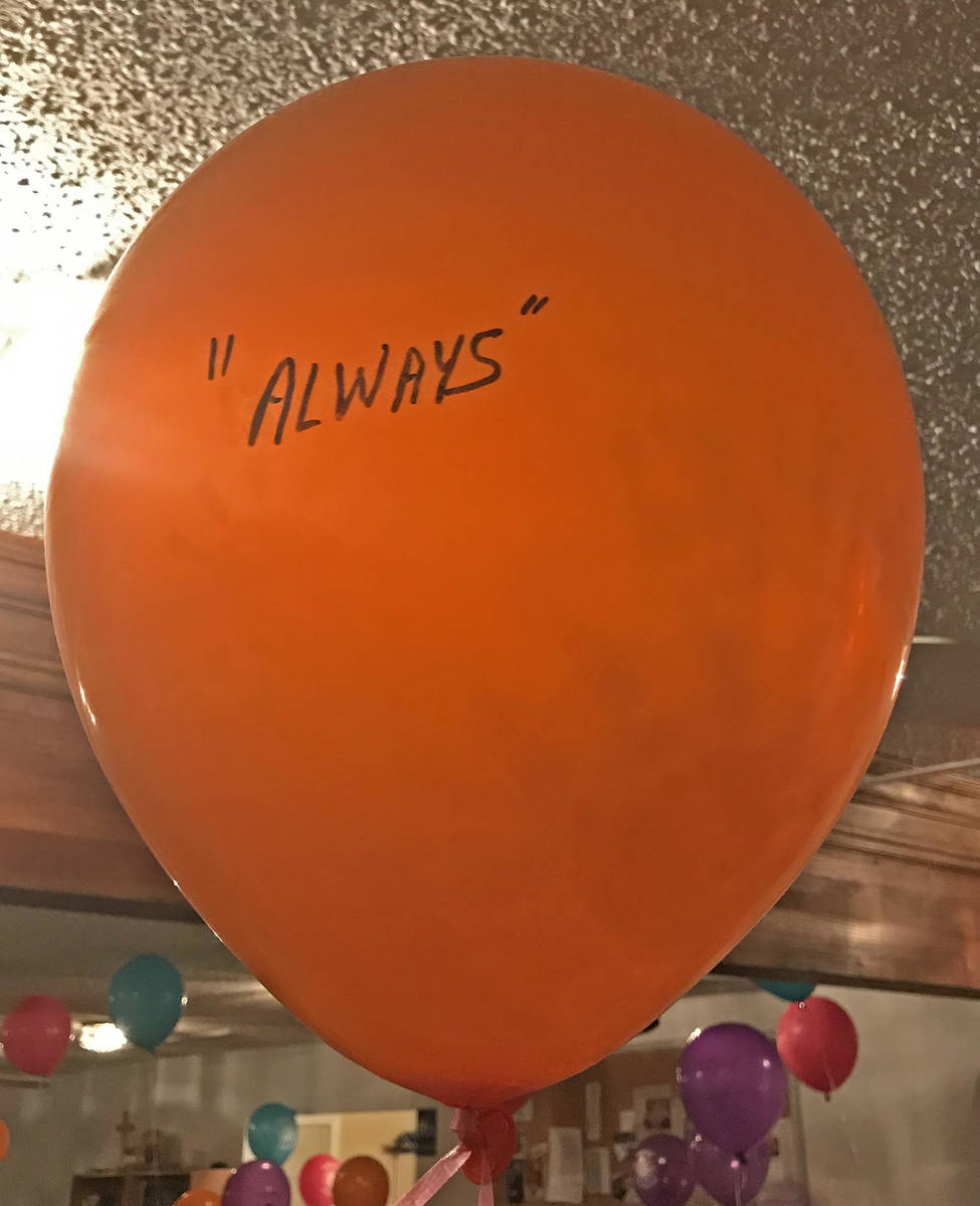 Robin Hebrock/Pahrump Valley Times A bright orange balloon was marked with a single loving word ...
