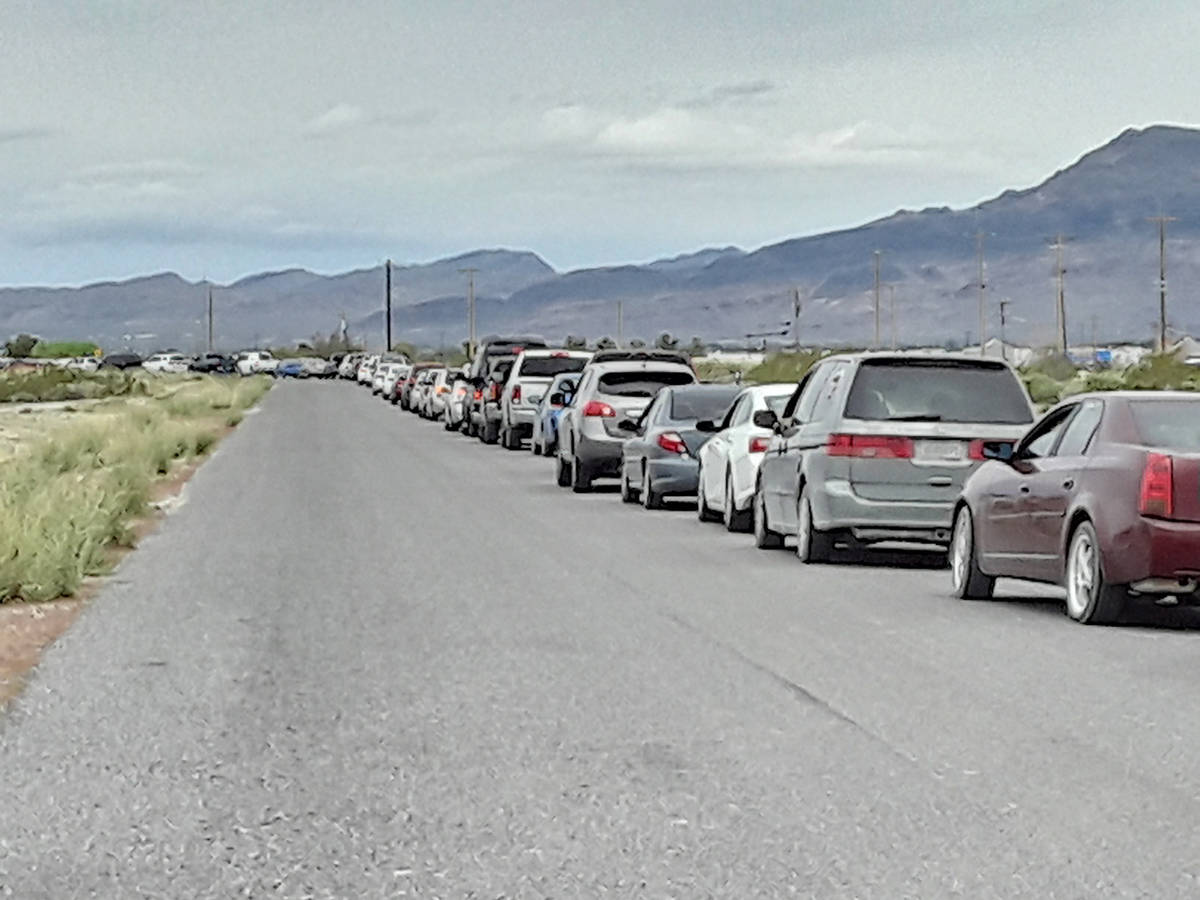 Selwyn Harris/Pahrump Valley Times Vehicles lined up from Raindance Drive off of Highway 372, a ...