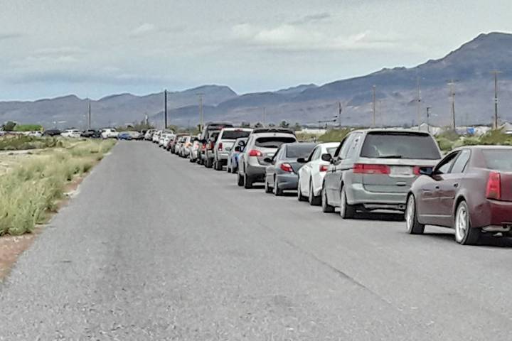 Selwyn Harris/Pahrump Valley Times Vehicles lined up from Raindance Drive off of Highway 372, a ...