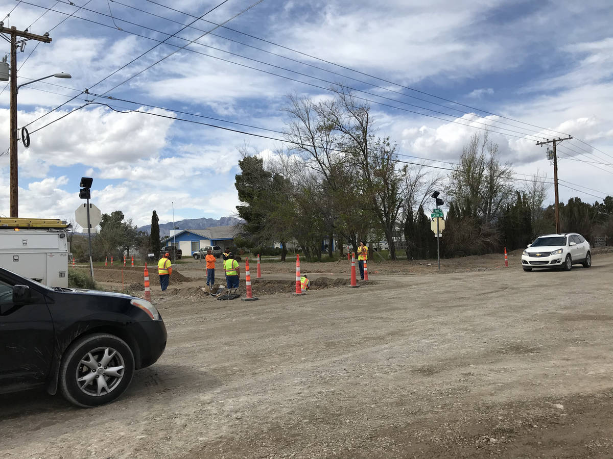 Robin Hebrock/Pahrump Valley Times Nye County Public Works crews are seen at the intersection o ...