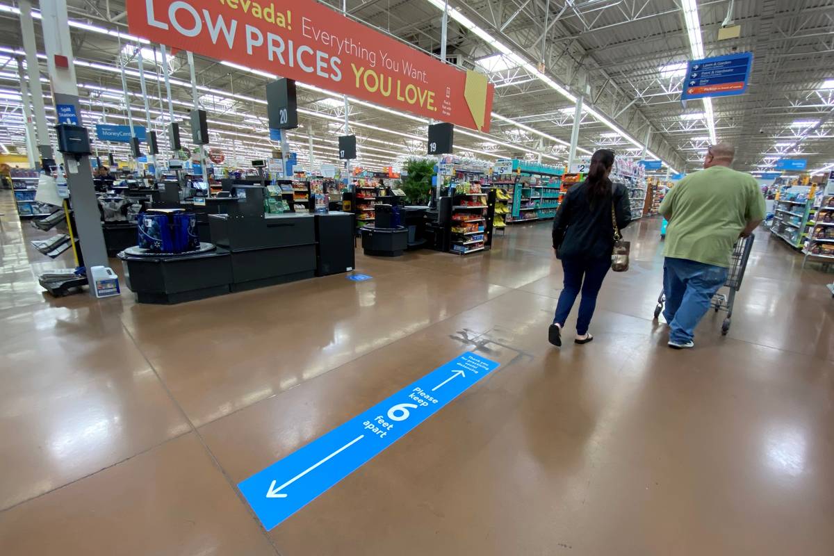 K.M. Cannon/Las Vegas Review-Journal Social distancing markings on the floor at Walmart Superce ...