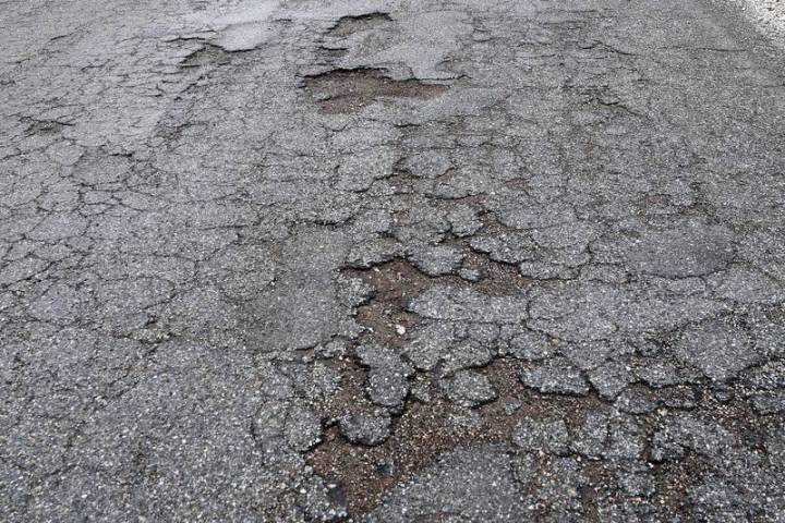 Richard Stephens/Special to the Pahrump Valley Times Potholes are present all along Rhyolite Ro ...