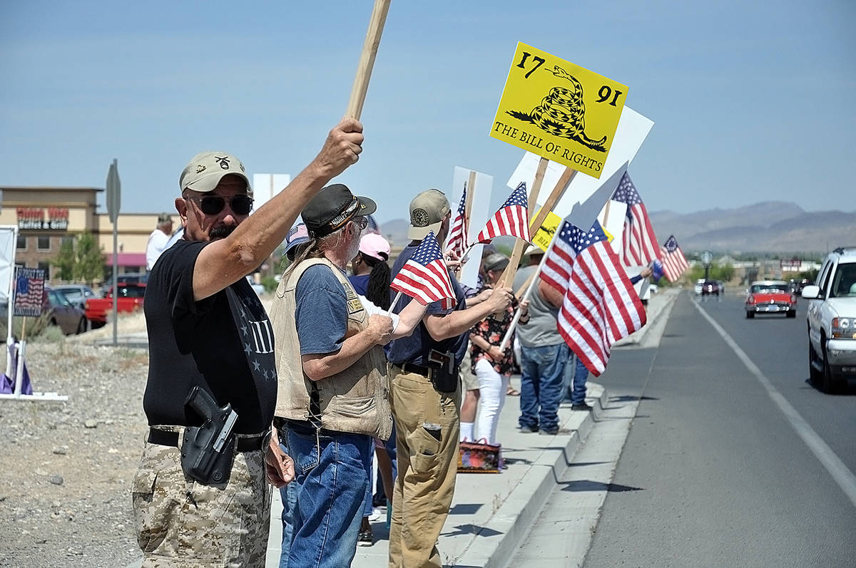 Horace Langford Jr./Pahrump Valley Times American flags and a variety of signs were hoisted int ...