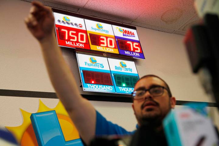 Jackpots, including the Powerball jackpot, are on display at the Lotto Store at Primm just insi ...