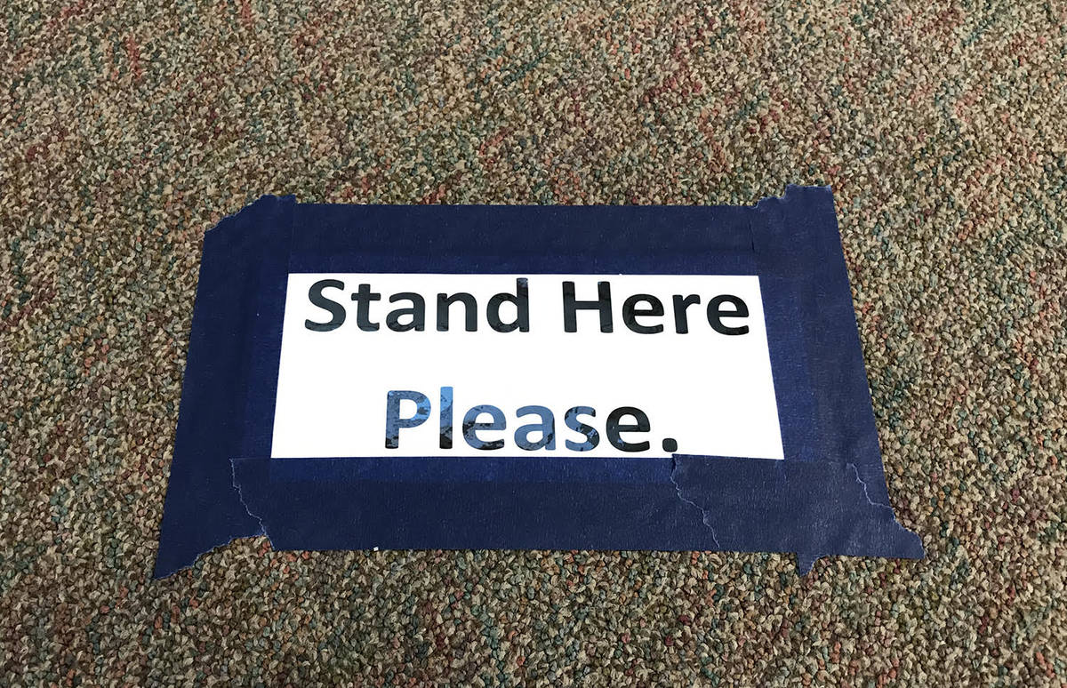 Robin Hebrock/Pahrump Valley Times Signs reading "stand here please" have been placed at six fo ...