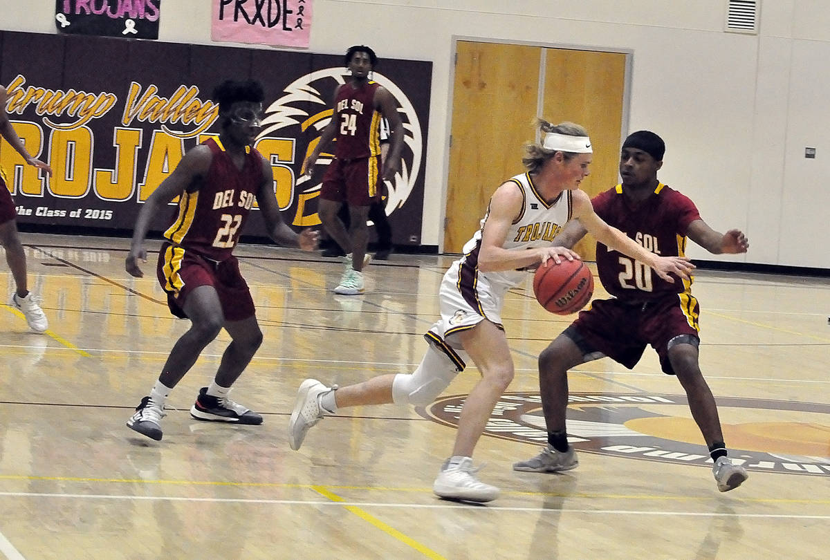 Horace Langford Jr./Pahrump Valley Times file Senior Grant Odegard brings the ball up the floor ...