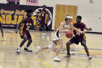 Horace Langford Jr./Pahrump Valley Times file Senior Grant Odegard brings the ball up the floor ...