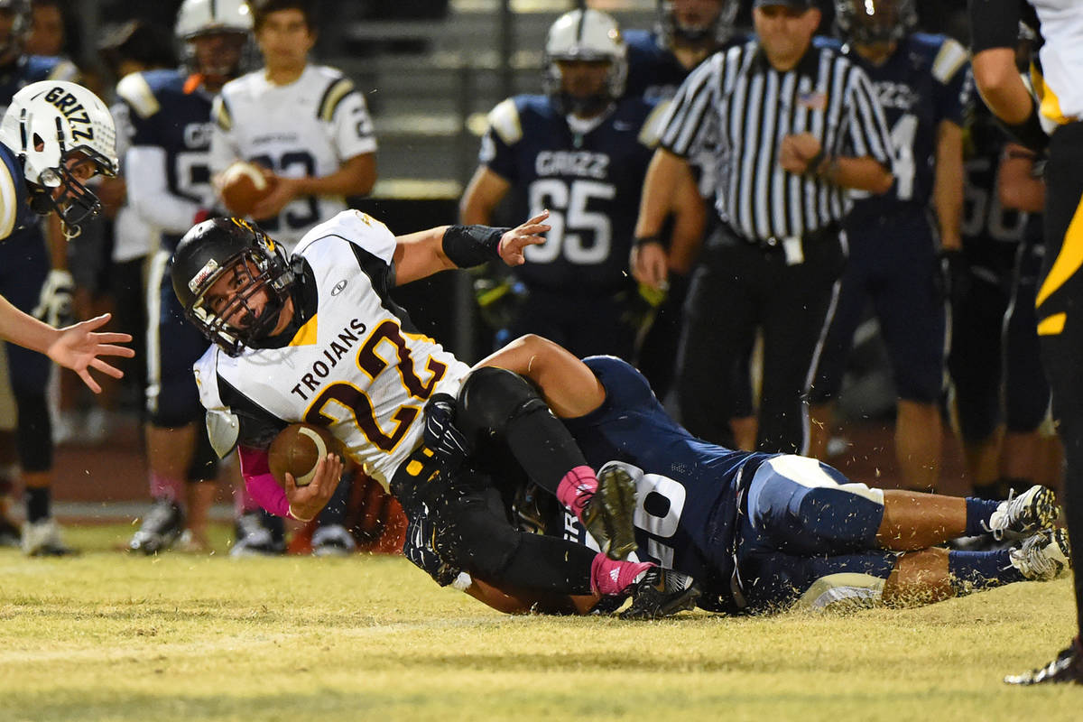 Peter Davis/Pahrump Valley Times file Pahrump Valley junior Tommy Gascoigne is brought down dur ...