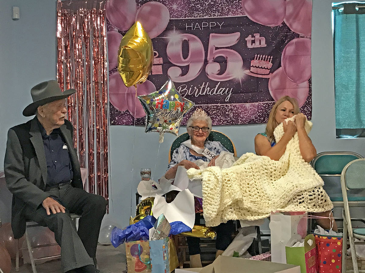 Robin Hebrock/Pahrump Valley Times BJ Hetrick-Irwin opens her birthday gifts while her daughter ...