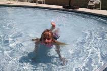 Lexis Bray/Pahrump Valley Times This file photo shows a valley youngster cooling off in the kid ...