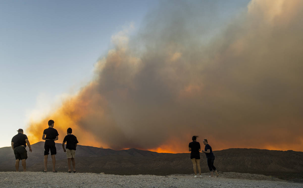 Onlookers stop to view the Mahogany Fire on Mount Charleston near a rise above Harris Spring Ro ...