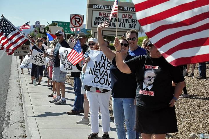 Horace Langford Jr./Pahrump Valley Times Several dozen area residents gathered along Highway 16 ...