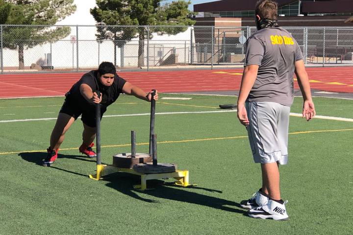 Tom Rysinski/Pahrump Valley Times A typical football practice drill shows a sign of the times: ...