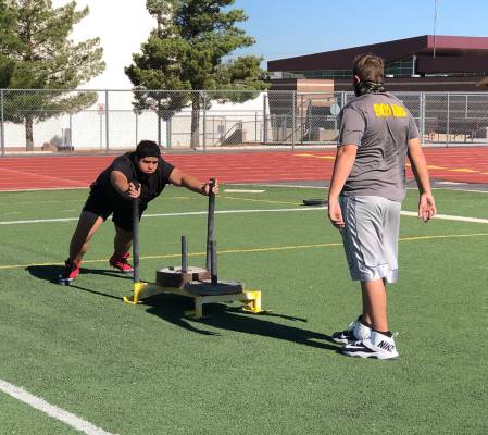 Tom Rysinski/Pahrump Valley Times A typical football practice drill shows a sign of the times: ...