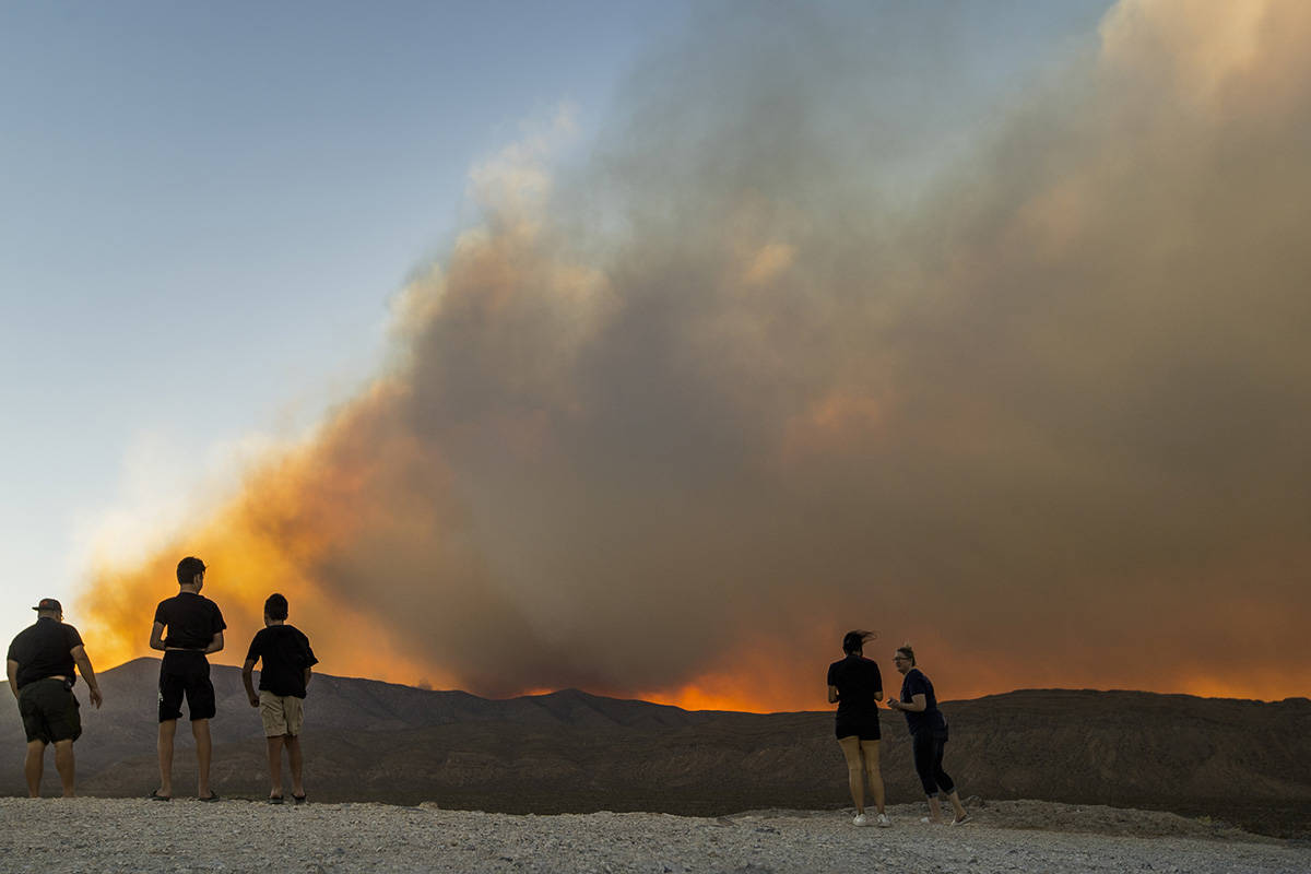 L.E. Baskow/Las Vegas Review-Journal Onlookers stop to view the Mahogany Fire on Mount Charlest ...