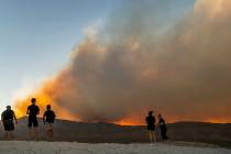 L.E. Baskow/Las Vegas Review-Journal Onlookers stop to view the Mahogany Fire on Mount Charlest ...