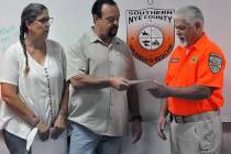 Horace Langford Jr./Pahrump Valley Times Stacie and David Hiebert present a check to Southern N ...