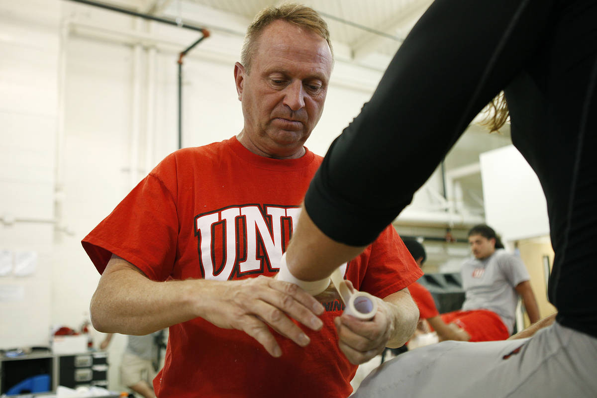 UNLV head athletic trainer Kyle Wilson, shown at 2013 training camp in Ely, was recently let go ...