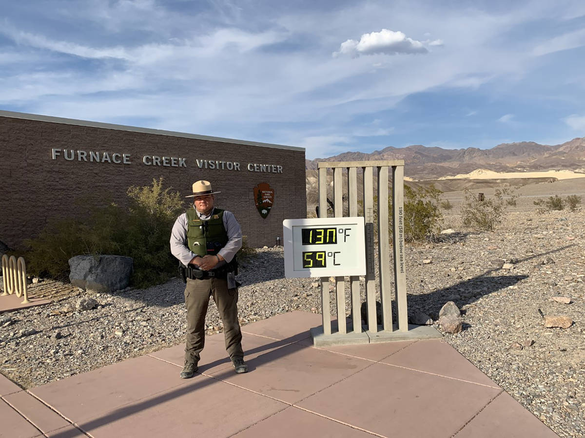 Special to the Pahrump Valley Times A Death Valley National Park Ranger stands beside a digital ...