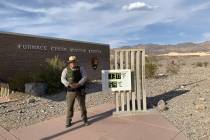 Special to the Pahrump Valley Times A Death Valley National Park Ranger stands beside a digital ...