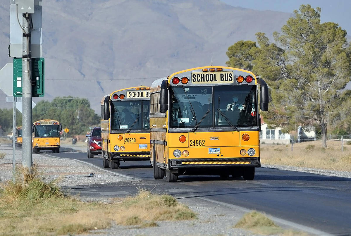 Horace Langford Jr./Pahrump Valley Times Buses are shown approaching Pahrump Valley High School ...