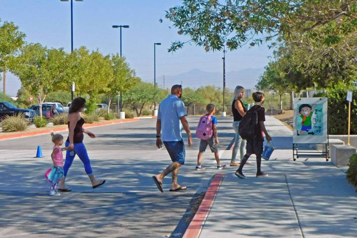 Robin Hebrock/Pahrump Valley Times Parents are seen escorting their students to the first day o ...