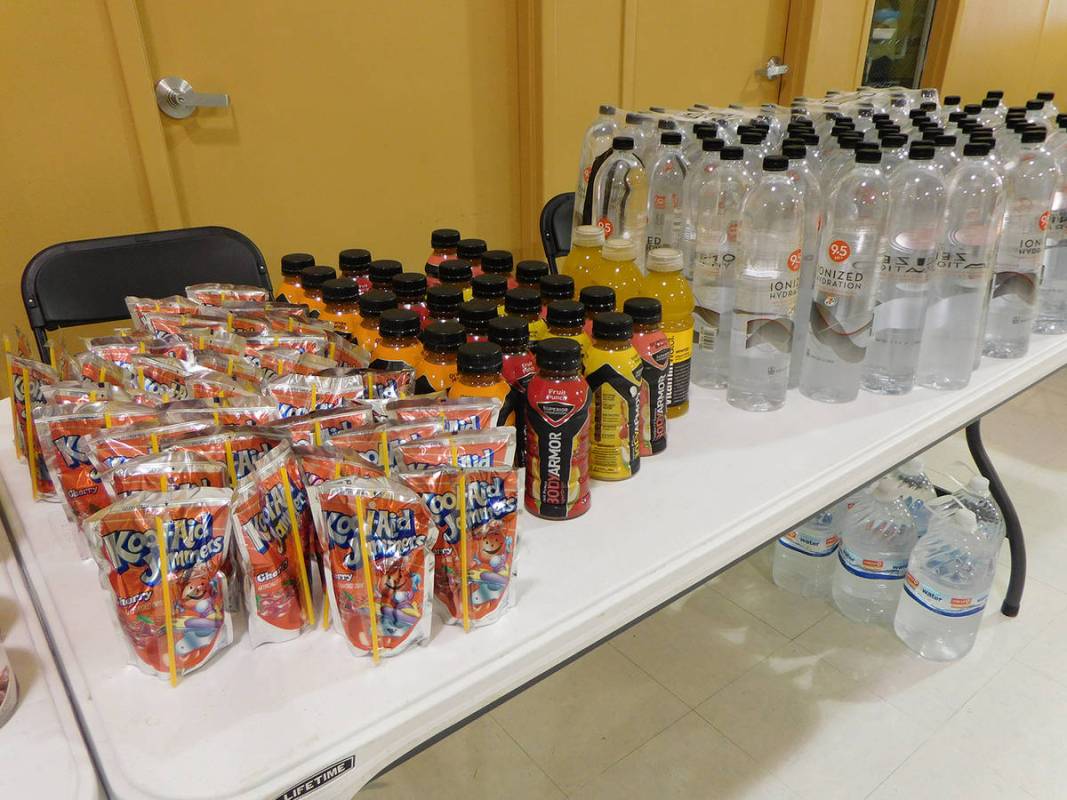 Robin Hebrock/Pahrump Valley Times Supplies of water and other drinks were provided for Homeles ...