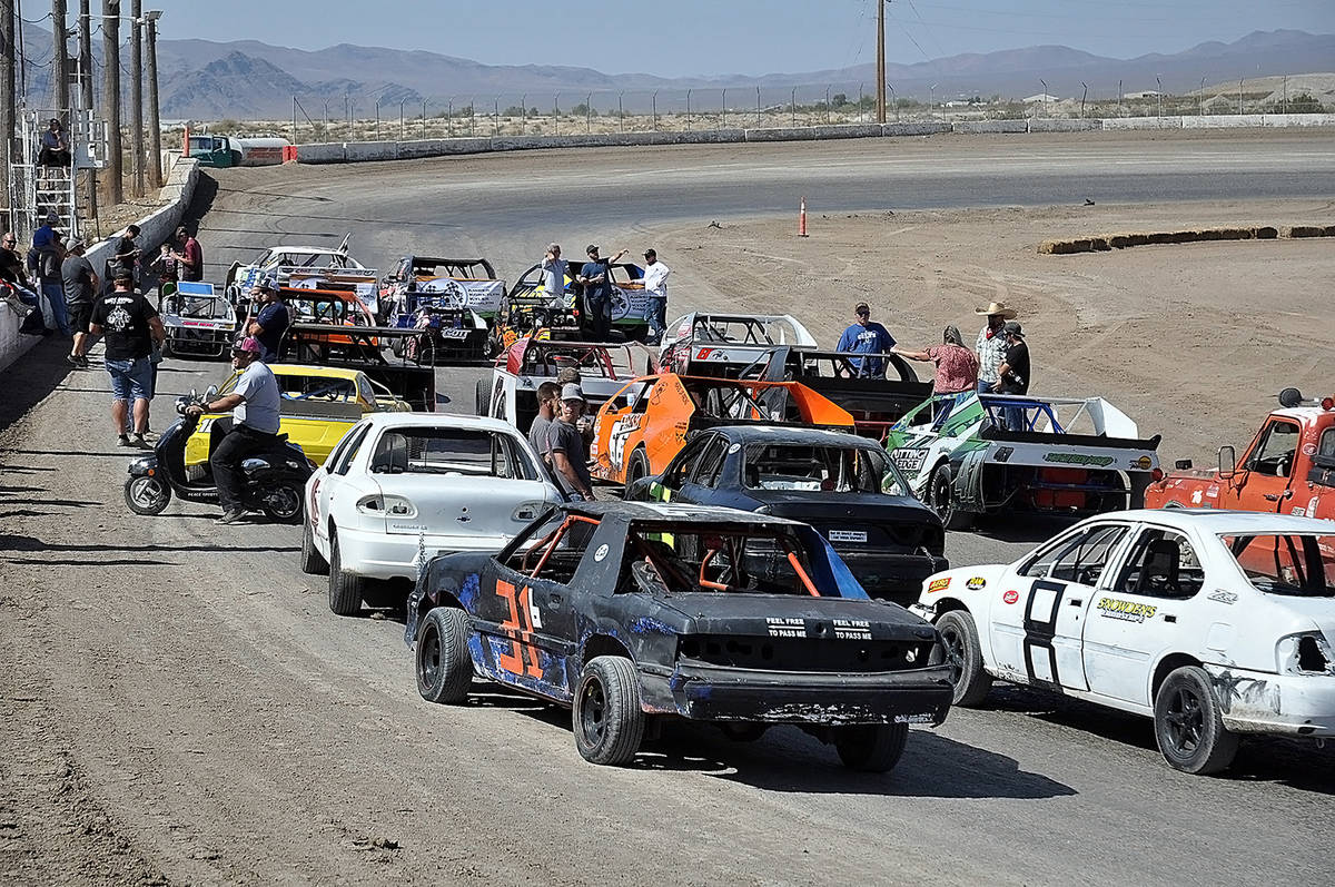 Horace Langford Jr./Pahrump Valley Times Cars line up to participate in the five memorial laps ...