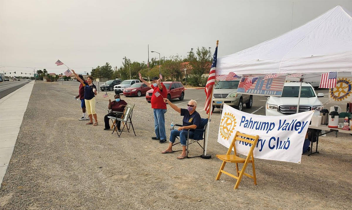 Photo courtesy of Pahrump Rotary Club Members of the Pahrump Valley Rotary Club lined north Hig ...