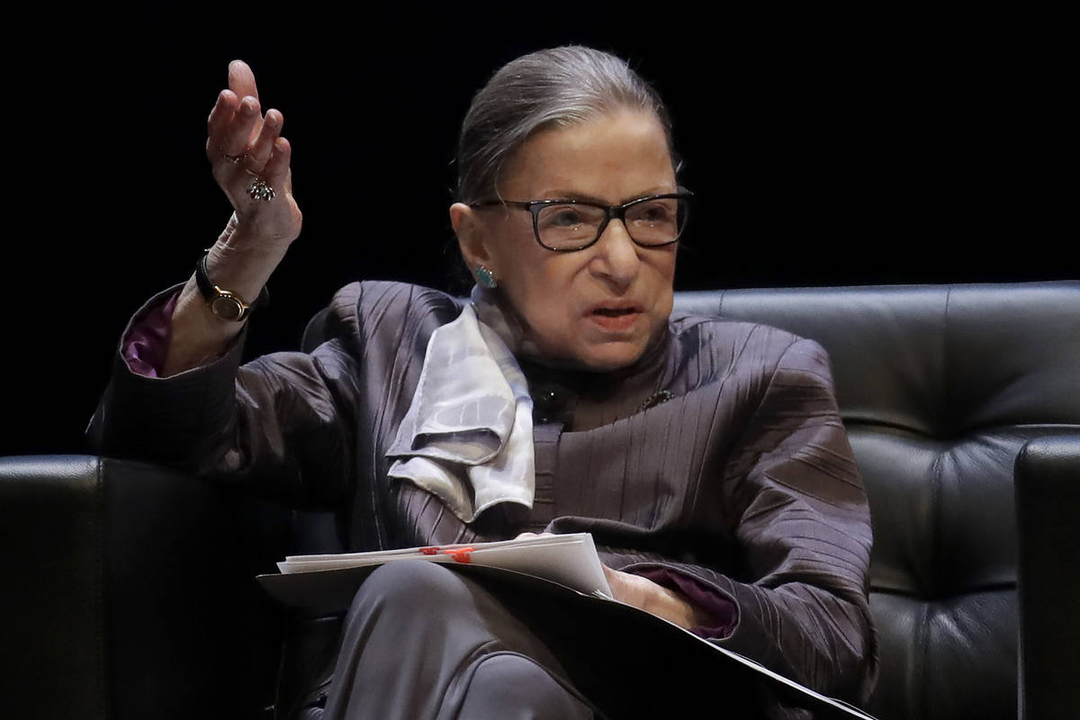 In this Oct. 21, 2019, file photo, U.S. Supreme Court Justice Ruth Bader Ginsburg gestures whil ...