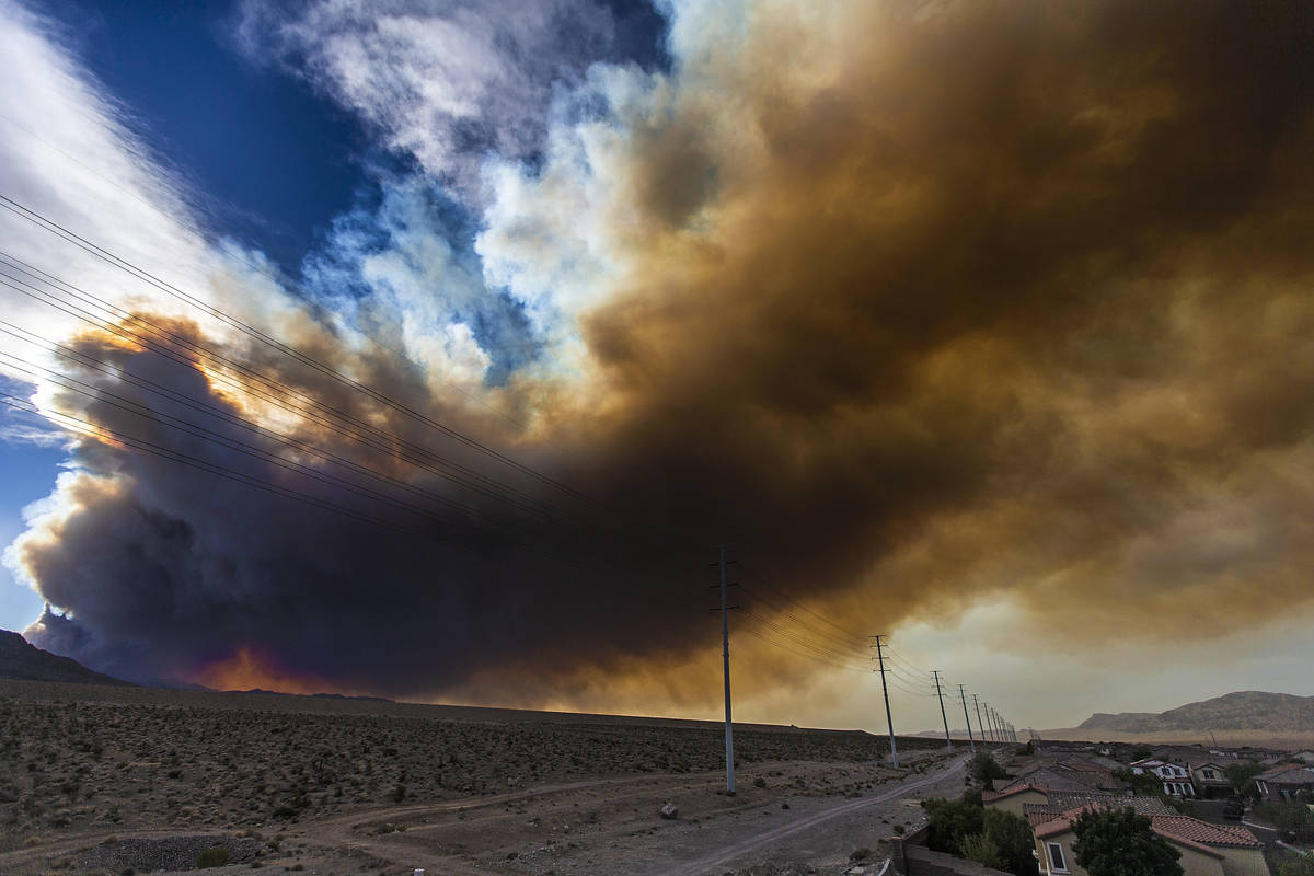 Smoke from a wildfire at Mount Charleston moves across the northwest valley on Sunday, June 28, ...