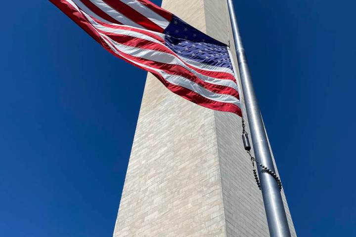 Getty Images An American flag flies half-staff at the Washington Monument in honor of Ruth Bad ...