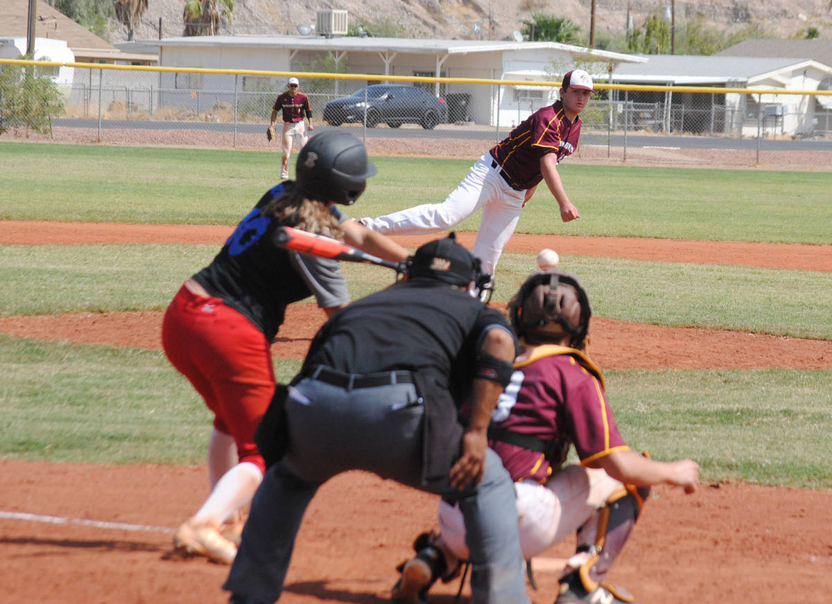 Charlotte Uyeno/Pahrump Valley Times Jake Riding delivers a pitch to Mohave's leadoff hitter du ...