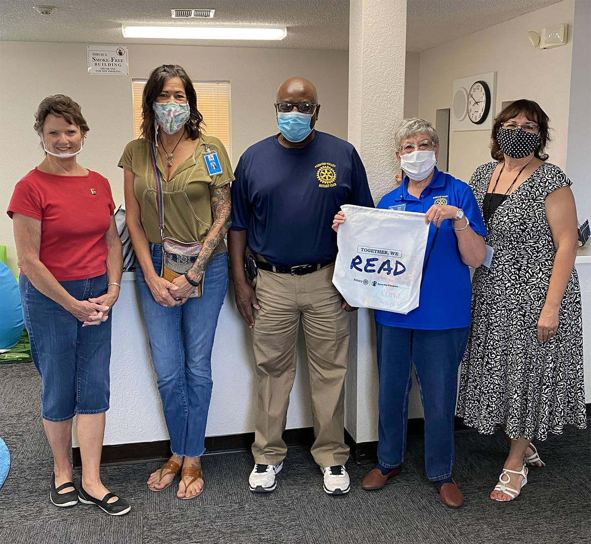 Special to the Pahrump Valley Times Pahrump Rotary Club member Janet Ufheil, at left, is joined ...