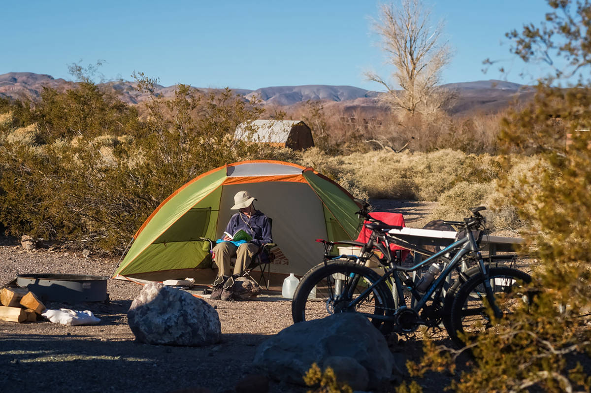 Kurt Moses/NPS A camper marvels at the splendor of Mesquite Spring Campground in Death Valley N ...