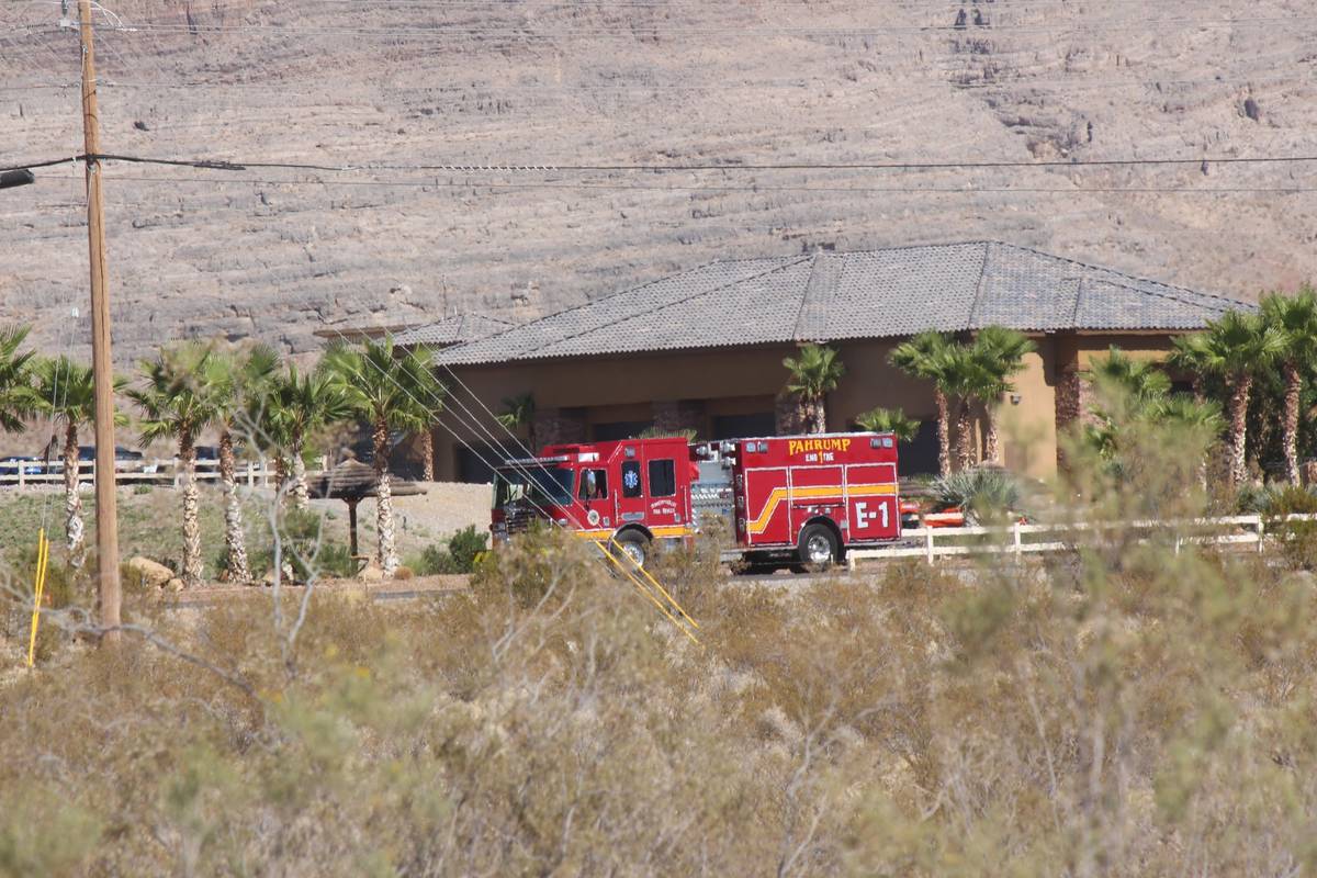 Jeffrey Meehan/Pahrump Valley Times A fire truck responds after a helicopter landed in a lake ...