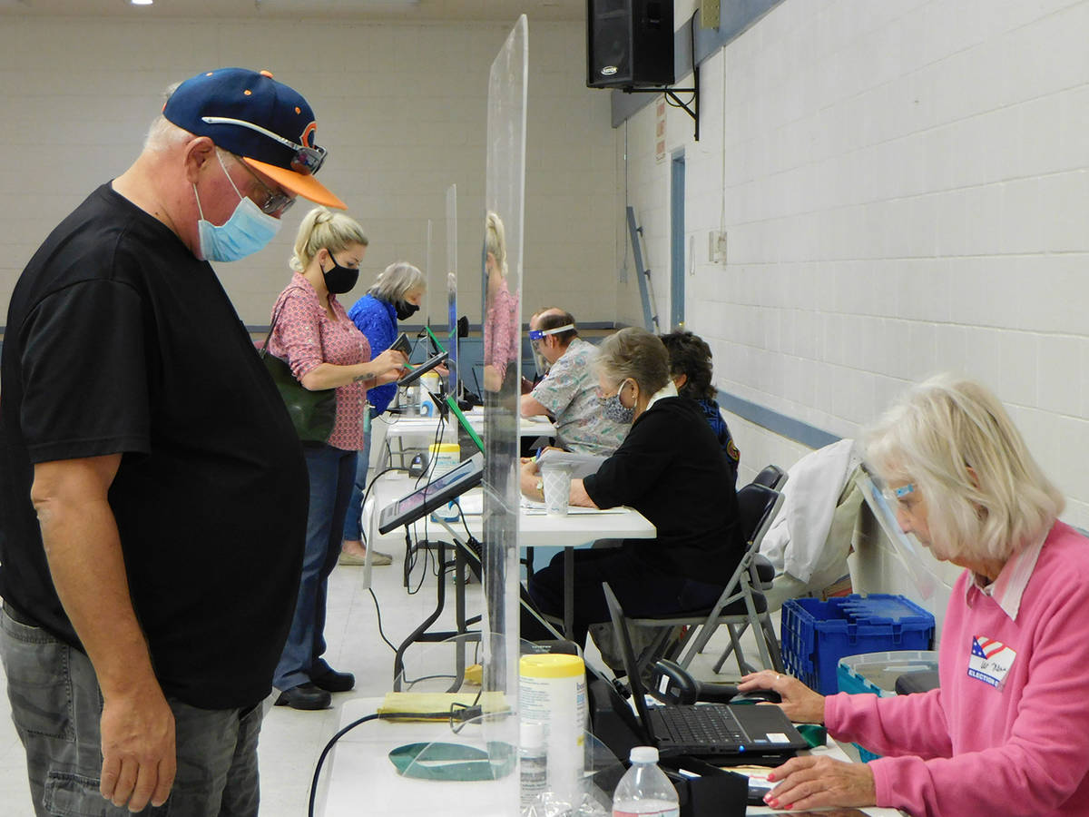 Robin Hebrock/Pahrump Valley Times Residents are seen checking in at the polls on Tuesday, Nov. 3.