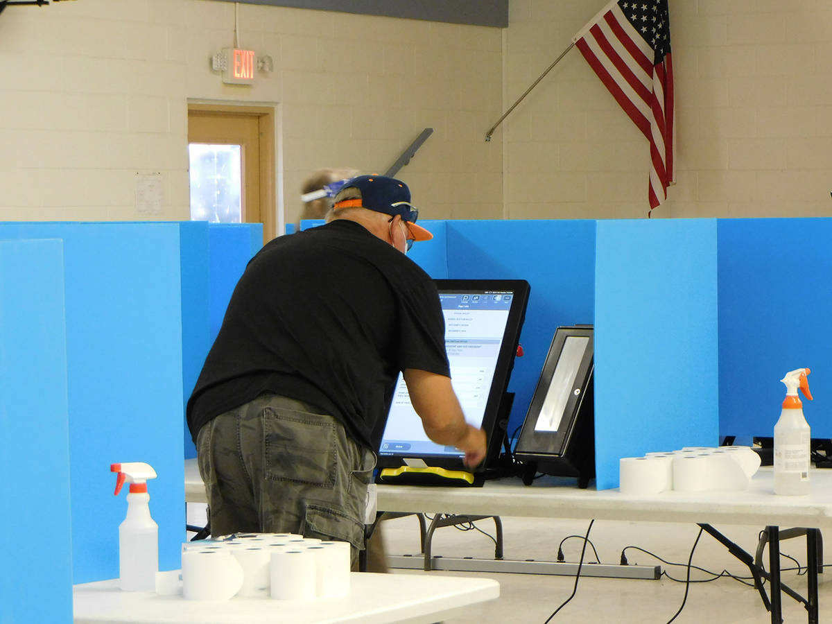 Robin Hebrock/Pahrump Valley Times A voter casts his vote in the 2020 general election.