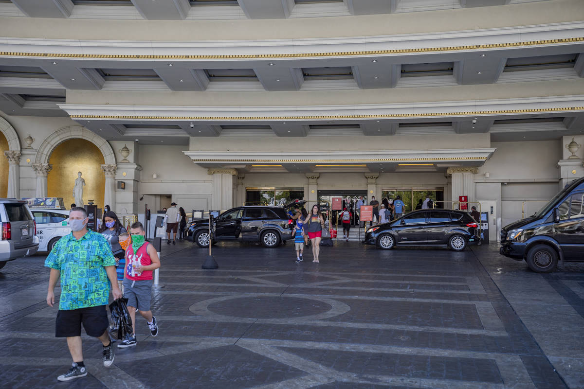 Elizabeth Brumley/Las Vegas Review-Journal Guests leave Caesars Palace hotel and casino on the ...