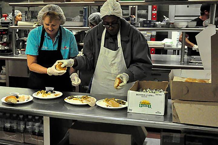 Selwyn Harris/Pahrump Valley Times This file photo shows volunteers preparing food for the Comm ...