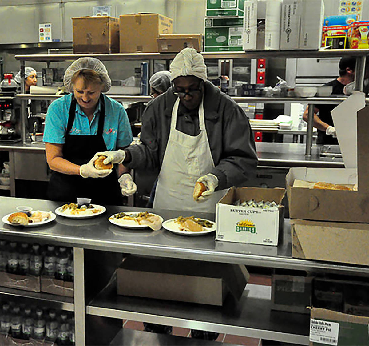 Selwyn Harris/Pahrump Valley Times This file photo shows volunteers preparing food for the Comm ...