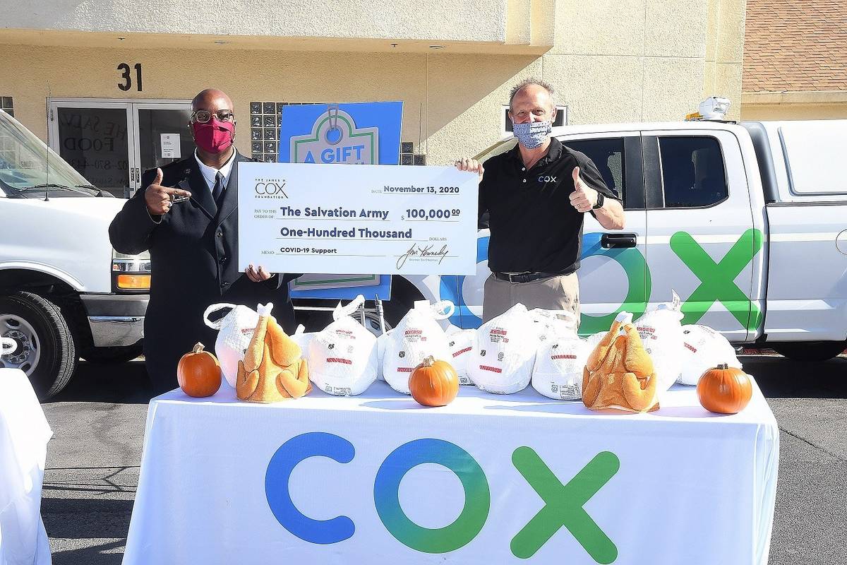 Special to the Pahrump Valley Times Captain Anthony Barnes with Cox’s David Diers, with $100 ...