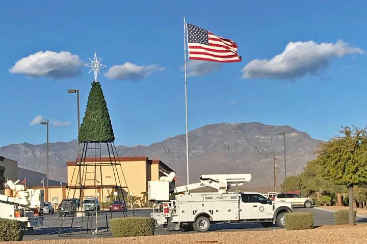 Robin Hebrock/Pahrump Valley Times Crews with Valley Electric Association are seen erecting the ...