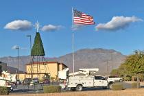 Robin Hebrock/Pahrump Valley Times Crews with Valley Electric Association are seen erecting the ...