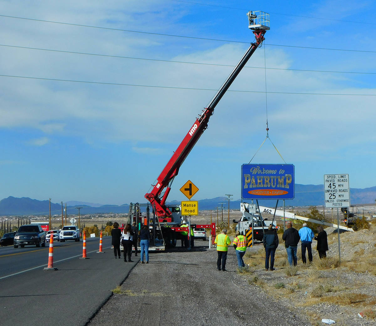 Robin Hebrock/Pahrump Valley Times Work crews with High Impact Signs and Designs are seen remov ...