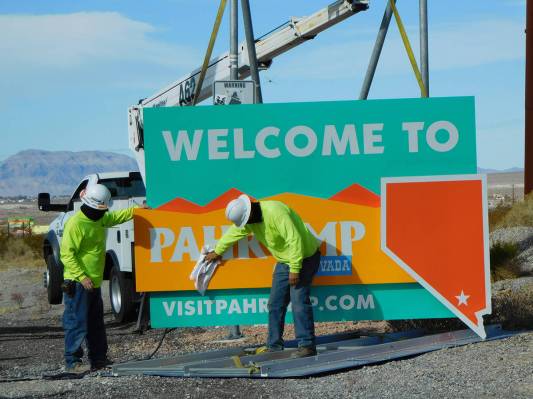 Robin Hebrock/Pahrump Valley Times Work crews give the new welcome signs a wipe-down prior to i ...