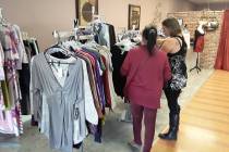 Selwyn Harris/Pahrump Valley Times A sales associate assists a shopper at Social Distraction Fa ...