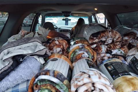 Special to the Pahrump Valley Times Blankets and other cold weather items are seen piled into t ...