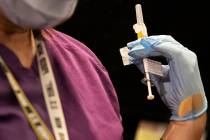 Benjamin Hager/Las Vegas Review-Journal A syringe containing the COVID-19 vaccine at the North ...
