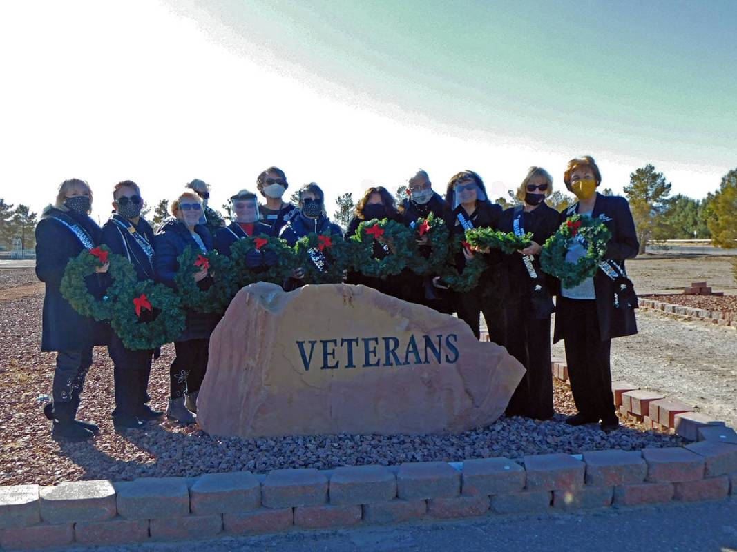 Robin Hebrock/Pahrump Valley Times The Nevada Silver Tappers are pictured holding the new Chris ...